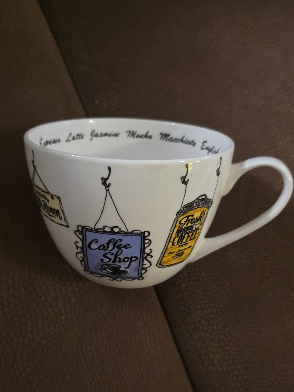 White Ceramic Mug with Blue & Yellow Coffee Shop Signs